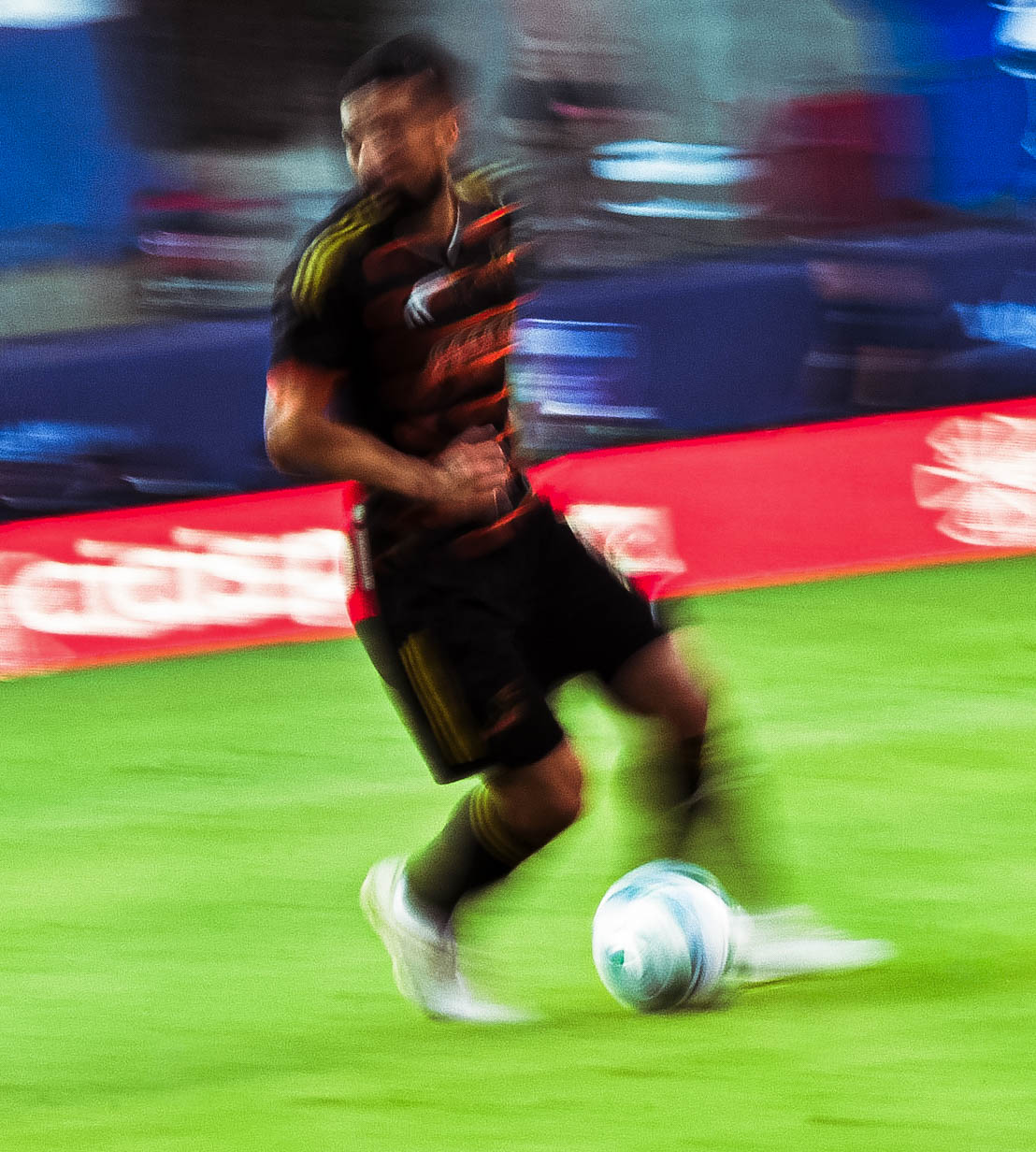 This is a FC Dallas soccer player dribbling.