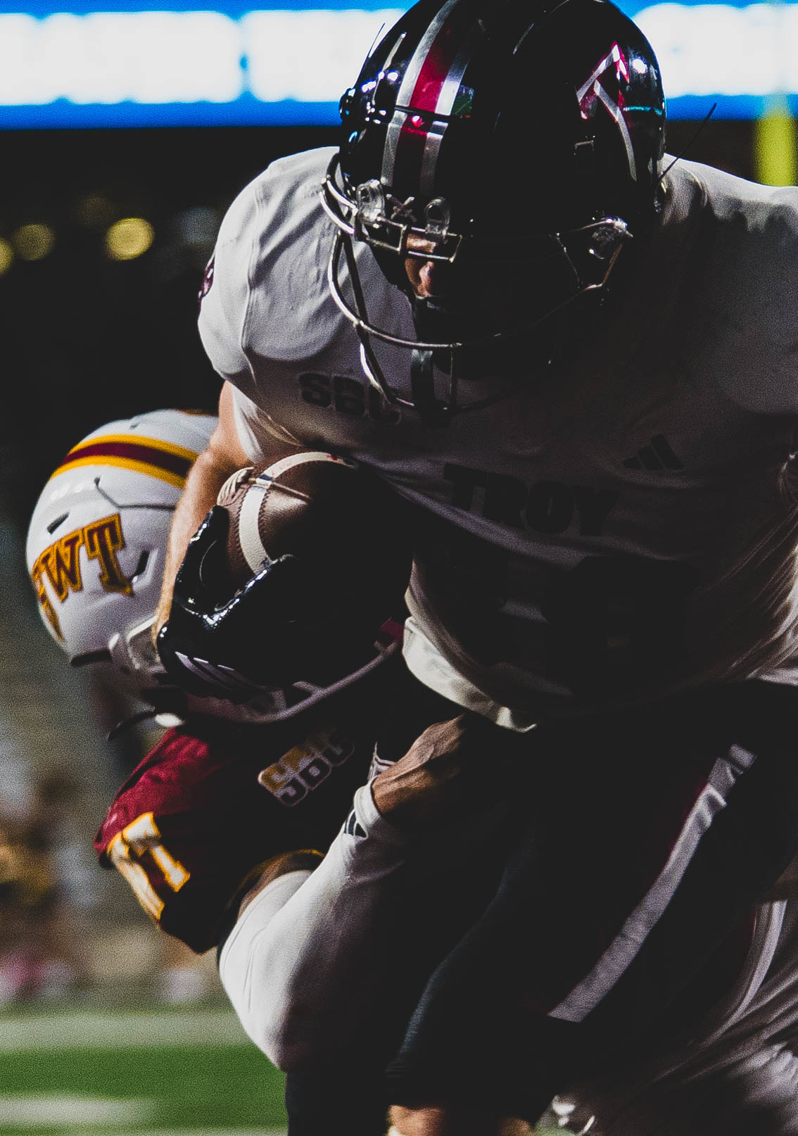 This is a football player being tackled.